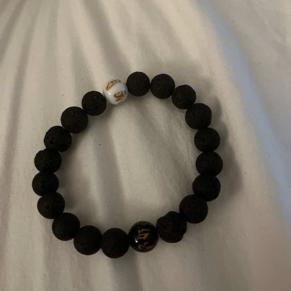 Elegant Black Lava Bead Bracelet with Gold and White Accents